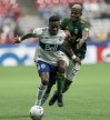 Vancouver Whitecaps forward Cristian Dájome (11) tries to break free from Portland Timbers forward Dairon Asprilla (27) during first half MLS soccer action in Vancouver, on Saturday, April 9, 2022. THE CANADIAN PRESS/Rich Lam