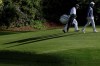 Scottie Scheffler and his caddie, Ted Scott, walk to Scheffler's tee shot on the 12th hole during the third round of the Masters golf tournament at Augusta National on Saturday, April 9, 2022, in Augusta, Ga. (Hyosub Shin/Atlanta Journal-Constitution via AP)