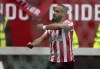 Brentford's Bryan Mbeumo celebrates scoring the first goal the game during the English Premier League soccer match between Brentford and West Ham United at the Brentford Community Stadium in London, Sunday, April 10, 2022. (AP Photo/Frank Augstein)