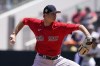 Boston Red Sox pitcher Garrett Whitlock throws in the second inning during a spring training baseball game against the Minnesota Twins at Hammond Stadium Sunday, March 27, 2022, in Fort Myers, Fla. (AP Photo/Steve Helber)