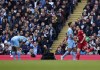 Liverpool's Diogo Jota, right, celebrates after scoring his side's opening goal during the English Premier League soccer match between Manchester City and Liverpool, at the Etihad stadium in Manchester, England, Sunday, April 10, 2022. (AP Photo/Jon Super)