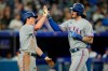 Texas Rangers catcher Jonah Heim (right) is congratulated by teammate Brad Miller after Heim hit a two-run home run against the Toronto Blue Jays during American League action in Toronto, Sunday, April 10, 2022. THE CANADIAN PRESS/Frank Gunn
