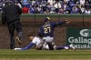 Chicago Cubs' Rafael Ortega (66) is called out at second base on steal attempt by Milwaukee Brewers shortstop Willy Adames (27) during the first inning of a baseball game, Sunday, April, 10, 2022, in Chicago. (AP Photo/David Banks)