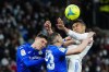 Real Madrid's Casemiro, right, goes for a header with Getafe defenders during the Spanish La Liga soccer match between Real Madrid and Getafe at the Santiago Bernabeu stadium in Madrid, Saturday, April 9, 2022. Real Madrid won 2-0. (AP Photo/Manu Fernandez)