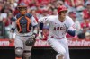 Los Angeles Angels' Shohei Ohtani, right, watches as he hits a ground rule double with Houston Astros catcher Martin Maldonado looking on during the third inning of a baseball game in Anaheim, Calif., Sunday, April 10, 2022. (AP Photo/Alex Gallardo)