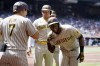 San Diego Padres' Jurickson Profar, right, celebrates his grand slam against the Arizona Diamondbacks with Padres' Ha-Seong Kim (7), of South Korea, as Padres' Luke Voit, middle, looks on during the second inning of a baseball game Sunday, April 10, 2022, in Phoenix. (AP Photo/Ross D. Franklin)