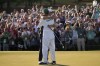 Scottie Scheffler hugs his caddie Ted Scott after winning the 86th Masters golf tournament on Sunday, April 10, 2022, in Augusta, Ga. (AP Photo/Jae C. Hong)