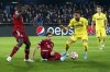 Bayern's Lucas Hernandez, center, vies for the ball with Villarreal's Arnaut Danjuma during a Champions League quarter-final, first leg soccer match between Villarreal and Bayern Munich at the Ceramica stadium in Villarreal, Spain, Wednesday, April 6, 2022. (AP Photo/Alberto Saiz)