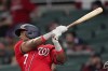 Washington Nationals' Maikel Franco (7) follows through on a three-run double in the eighth inning of a baseball game against the Atlanta Braves, Monday, April 11, 2022, in Atlanta. (AP Photo/John Bazemore)