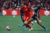 Canada's Jessie Fleming (17) looks for an opening as Nigeria's Busayo Ajibade (15) tries for the steal during first half soccer action during the national team celebration tour at Starlight Stadium in Langford, B.C., Monday, April 11, 2022. THE CANADIAN PRESS/Chad Hipolito