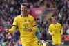 Chelsea's Mason Mount celebrates after scoring his side's sixth goal during the English Premier League soccer match between Southampton and Chelsea at the Saint Mary's Stadium in Southampton, Saturday, April 9, 2022. (AP Photo/Frank Augstein)
