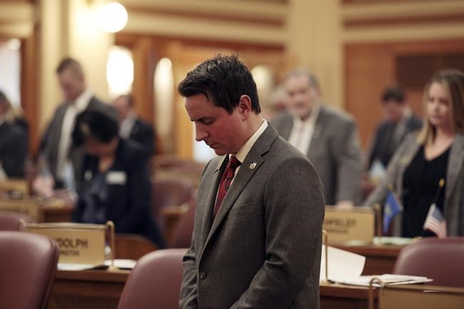 Republican state Rep. Will Mortenson prays before the South Dakota House voted to impeach South Dakota Attorney General Jason Ravnsborg in Pierre, S.D., on Tuesday, April 12, 2022. Mortenson drew up the articles of impeachment for Ravnsborg, who struck and killed a man with his vehicle in 2020. The House voted 36-31 to impeach Ravnsborg. (AP Photo/Stephen Groves)