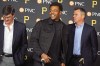 Pittsburgh Pirates' Ke'Bryan Hayes, center, stands between team owner Bob Nutting, left, and general manager Ben Cherington, after announcing the signing of the third baseman to an eight-year contract extension through the 2029 season with a club option for the 2030 season, before the Pirates home opening baseball game against the Chicago Cubs in Pittsburgh, Tuesday, April 12, 2022. (AP Photo/Gene J. Puskar)
