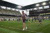 Nashville SC MLS soccer players warm up during their first practice in GEODIS Park Tuesday, April 12, 2022, in Nashville, Tenn. Construction and some final touches are being completed with the team scheduled to play their first game in the 30,000-seat stadium May 1 against Philadelphia Union. (AP Photo/Mark Humphrey)