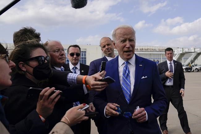 President Joe Biden speaks to reporters before boarding Air Force One at Des Moines International Airport, in Des Moines Iowa, Tuesday, April 12, 2022, en route to Washington. Biden said that Russia's war in Ukraine amounted to a