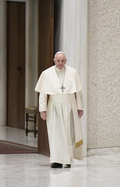 Pope Francis arrives to attend his weekly general audience in the Paul VI Hall at The Vatican, Wednesday, April 13, 2022. (AP Photo/Andrew Medichini)