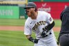 Pittsburgh Pirates' Ben Gamel celebrates as he heads to the dugout after hitting a three-run home run off Chicago Cubs starting pitcher Kyle Hendricks in the first inning of a baseball game in Pittsburgh, Wednesday, April 13, 2022. (AP Photo/Gene J. Puskar)