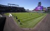 Players warms up for the team's regular-season home opener Thursday, April 7, 2022, in Coors Field in Denver. The Rockies host the Los Angeles Dodgers Friday to kick off a three-game weekend set. (AP Photo/David Zalubowski)