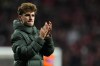 Atletico Madrid's Antoine Griezmann addresses fans after the Champions League quarterfinal second leg soccer match between Atletico Madrid and Manchester City at Wanda Metropolitano stadium in Madrid, Spain, Wednesday, April 13, 2022. (AP Photo/Manu Fernandez)