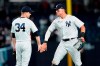 New York Yankees' Michael King, left, and Aaron Judge celebrate after a baseball game against the Toronto Blue Jays, Thursday, April 14, 2022, in New York. (AP Photo/Frank Franklin II)
