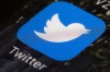 FILE- The Twitter icon is displayed on a mobile phone in Philadelphia on April 26, 2017.  Twitter said in a statement Friday, April 15, 2022, that its board of directors has unanimously adopted a “poison pill” defense in response to Tesla CEO Elon Musk’s proposal to buy the company and take it private.  (AP Photo/Matt Rourke, File)