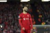 Liverpool's Mohamed Salah reacts after missing a chance during the Champions League quarterfinal second leg soccer match between Liverpool and Benfica, at Anfield stadium in Liverpool, England, Wednesday, April 13, 2022. (AP Photo/Jon Super)