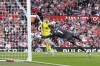Norwich City's Kieran Dowell, centre, scores past Manchester United's goalkeeper David de Gea during the English Premier League soccer match between Manchester United and Norwich City at Old Trafford stadium in Manchester, England, Saturday, April 16, 2022. (AP Photo/Jon Super)