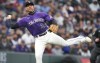 Colorado Rockies third baseman Ryan McMahon throws to first base to retire Chicago Cubs' Rafael Ortega during the third inning of a baseball game Saturday, April 16, 2022, in Denver. (AP Photo/David Zalubowski)