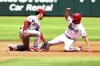 Los Angeles Angels shortstop Andrew Velazquez (4) tags out Texas Rangers Charlie Culberson (11) who attempts a steal in the fourth inning of a baseball game, Sunday, April 17, 2022, in Arlington, Texas. (AP Photo/Richard W. Rodriguez)