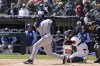 Tampa Bay Rays' Manuel Margot hits a one-run single during the first inning of a baseball game against the Chicago White Sox in Chicago, Sunday, April 17, 2022. (AP Photo/Nam Y. Huh)