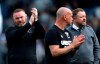 Derby County manager Wayne Rooney applauds the fans at the Kiyan Prince Foundation Stadium, London, Monday April 18, 2022. Wayne Rooney's Derby County has been relegated to the third tier of English soccer to cap a miserable season that also saw the club docked 21 points for breaches of financial rules. A 1-0 loss at Queens Park Rangers left Derby 10 points from safety with three games remaining in the second-tier Championship. (Steven Paston/PA via AP)