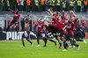 AC Milan players celebrate at the end of the Serie A soccer match between AC Milan and Genoa, at the San Siro stadium in Milan, Italy, Friday, April 15, 2022. AC Milan won 2-0. (AP Photo/Luca Bruno)