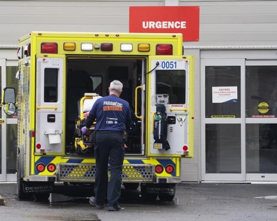 A paramedic loads his stretcher back into the ambulance after bringing a patient to the emergency room at a hospital in Montreal, Thursday, April 14, 2022. Latest data from the Public Health Agency of Canada shows hospitalizations due to COVID-19 rose about 18 per cent across Canada between April 4 and April 11 — to 6,020 people needing beds from 5,109. THE CANADIAN PRESS/Ryan Remiorz