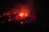 Marseille fans light flares during the Europa Conference League quarterfinal soccer match between Olympique Marseille and PAOK FC at the Velodrome stadium in Marseille, southern France, Thursday, April 7, 2022. (AP Photo/Daniel Cole)