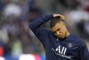 PSG's Kylian Mbappe reacts during the warm up before the League One soccer match between Paris Saint Germain and Marseille, at the Parc des Princes stadium, in Paris, France, Sunday, April 17, 2022. (AP Photo/Francois Mori)