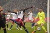 Hamburg's Bakery Jatta tries for a goal against the Freiburg's goalkeeper Mark Flekken during the German Cup, semifinal soccer match between Hamburger SV and SC Freiburg in Hamburg, Germany, Tuesday, April 19, 2022. (AP Photo/Martin Meissner)