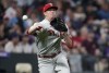 Philadelphia Phillies starting pitcher Kyle Gibson throws to first base to put out Colorado Rockies' Charlie Blackmon on a sacrifice bunt during the fifth inning of a baseball game Tuesday, April 19, 2022, in Denver. (AP Photo/David Zalubowski)