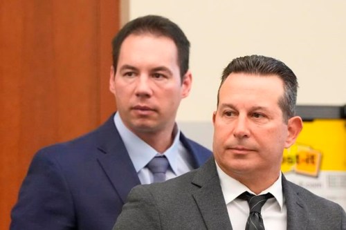 FILE —In this file photo from Feb. 28, 2022, Dr. William Husel, left, and defense attorney Jose Baez stand during Husel's trial in Columbus, Ohio. A jury on Wednesday, April 20, 2022 acquitted Husel in the deaths of multiple hospital patients. Husel was accused of ordering excessive painkillers for patients in the Columbus-area Mount Carmel Health System. (Barbara J. Perenic/The Columbus Dispatch via AP, Pool, File)