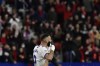 Real Madrid's Karim Benzema reacts after his second penalty kick was saved by Osasuna's goalkeeper Sergio Herrera during a Spanish La Liga soccer match between Osasuna and Real Madrid at El Sadar stadium in Pamplona, Spain, Wednesday, April 20, 2022. (AP Photo/Alvaro Barrientos)