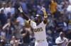 San Diego Padres' Jurickson Profar reacts after hitting a two-run home run during the fourth inning of a baseball game against the Cincinnati Reds, Wednesday, April 20, 2022, in San Diego. (AP Photo/Gregory Bull)