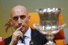 FILE - President of the Spanish Soccer Federation, Luis Rubiales, listens to a reporter as he sets near the Spanish Super Cup, during a press conference with Saudi General Sport Authority chairman Prince Abdulaziz bin Turki Al-Faisal in Jiddah Saudi Arabia, Wednesday, Dec. 18, 2019. After being widely criticized across Spain, the president of the Spanish soccer federation said Thursday he will remove the salary variables that he earned when Barcelona and Real Madrid succeeded. (AP Photo/Amr Nabil, File)