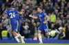 Chelsea's Cesar Azpilicueta, right, celebrates after scoring his sides second goal of the game during the English Premier League soccer match between Chelsea and Arsenal at Stamford Bridge in London, Wednesday, April 20, 2022. (AP Photo/Frank Augstein)