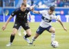 CF Montreal's Alistair Johnston (22) challenges Vancouver Whitecaps' Ryan Raposo during second half MLS soccer action in Montreal, Saturday, April 16, 2022.&nbsp;&nbsp;After a rocky start to the season that saw them bow out of the CONCACAF Champions League and start their Major League Soccer campaign with three consecutive losses, CF Montréal appear to have righted the ship.THE CANADIAN PRESS/Graham Hughes