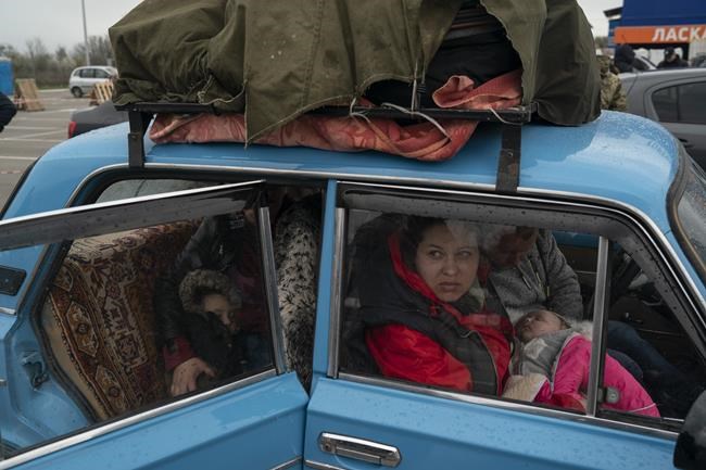 Internally displaced people from Mariupol and nearby towns arrive at a refugee center fleeing from the Russian attacks, in Zaporizhzhia, Ukraine, Thursday, April 21, 2022. Mariupol, which is part of the industrial region in eastern Ukraine known as the Donbas, has been a key Russian objective since the Feb. 24 invasion began. (AP Photo/Leo Correa)