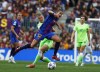 Barcelona's Patricia Guijarro, center right, fights for the ball against Wolfsburg's Alexandra Popp during the Women's Champions League semifinal, first leg soccer match between Barcelona and Wolfsburg at Camp Nou stadium in Barcelona, Spain, Friday, April 22, 2022. (AP Photo/Joan Monfort)