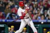 Philadelphia Phillies' Alec Bohm hits a two-run single off Milwaukee Brewers relief pitcher Brad Boxberger during the eighth inning of a baseball game, Friday, April 22, 2022, in Philadelphia. (AP Photo/Matt Slocum)