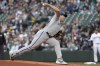 Kansas City Royals starting pitcher Brad Keller throws against the Seattle Mariners during the first inning of a baseball game, Friday, April 22, 2022, in Seattle. (AP Photo/Jason Redmond)