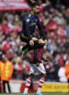 Manchester United's Cristiano Ronaldo warms up before the start of an English Premier League soccer match between Arsenal and Manchester United at the Emirates stadium in London, Saturday April 23, 2022. (AP Photo/Alastair J. Grant)