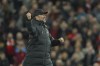 Liverpool's manager Jurgen Klopp applauds fans at the end of the English Premier League soccer match between Liverpool and Manchester United at Anfield stadium in Liverpool, England, Tuesday, April 19, 2022. (AP Photo/Jon Super)