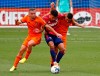 FC Dallas midfielder Edwin Cerrillo, center, is sandwiched between Houston Dynamo forward Sebastián Ferreira (9) and midfielder Matías Vera, right, during the first half of an MLS soccer match in Frisco, Texas, Saturday, April 23, 2022. (Stewart F. House/The Dallas Morning News via AP)